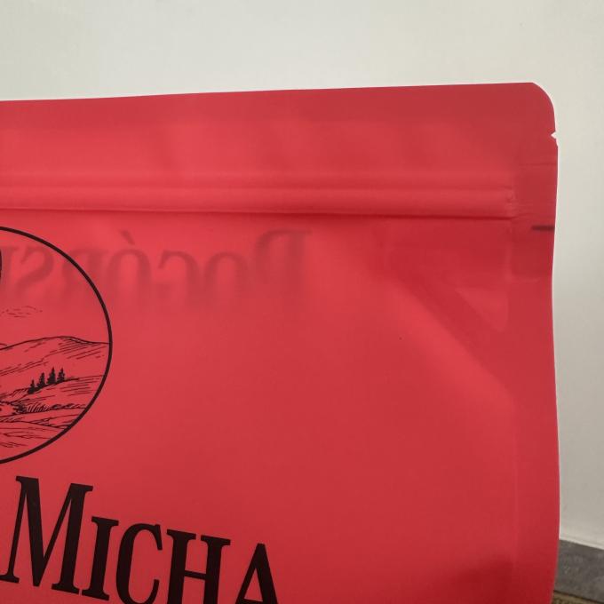 Closeâ€‘up of resealable zipper top with tear noth on custom printed red dog food packaging bag